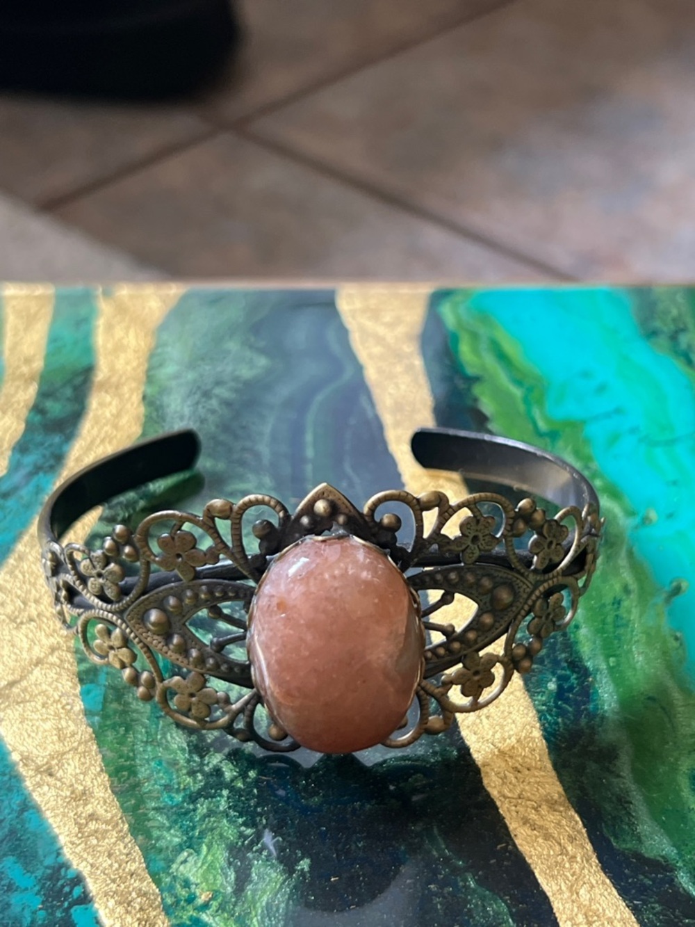 Filigree Cuff Bracelet with Peach Stone Center